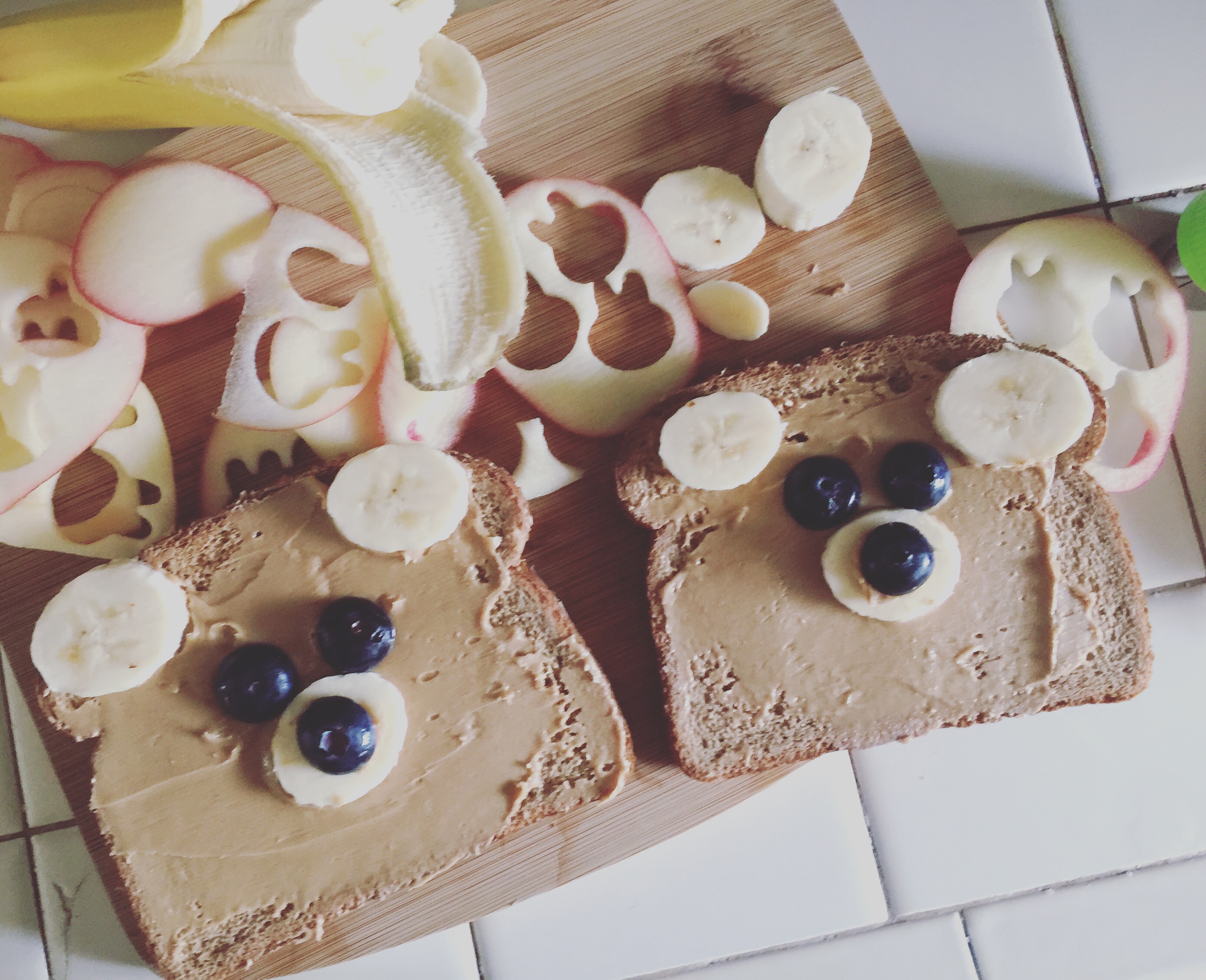 Peanut Butter Bear Toasts using bananas and blueberries. With Apple Bunnies carved with a cookie cutter.