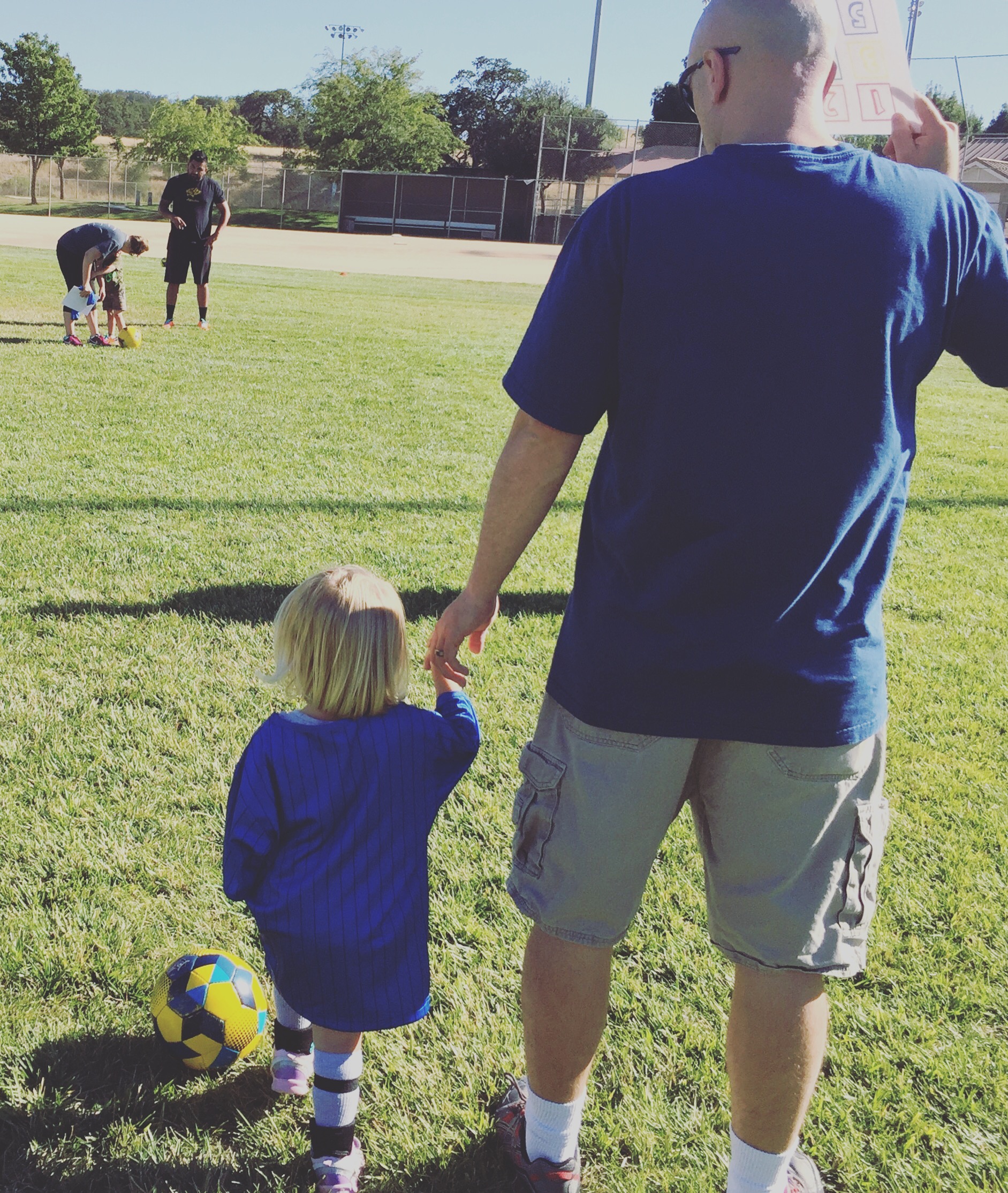 Daddy and Daughter at Kidz Love Soccer class in Paso Robles California as blogged about on Two In Tow & On The Go.