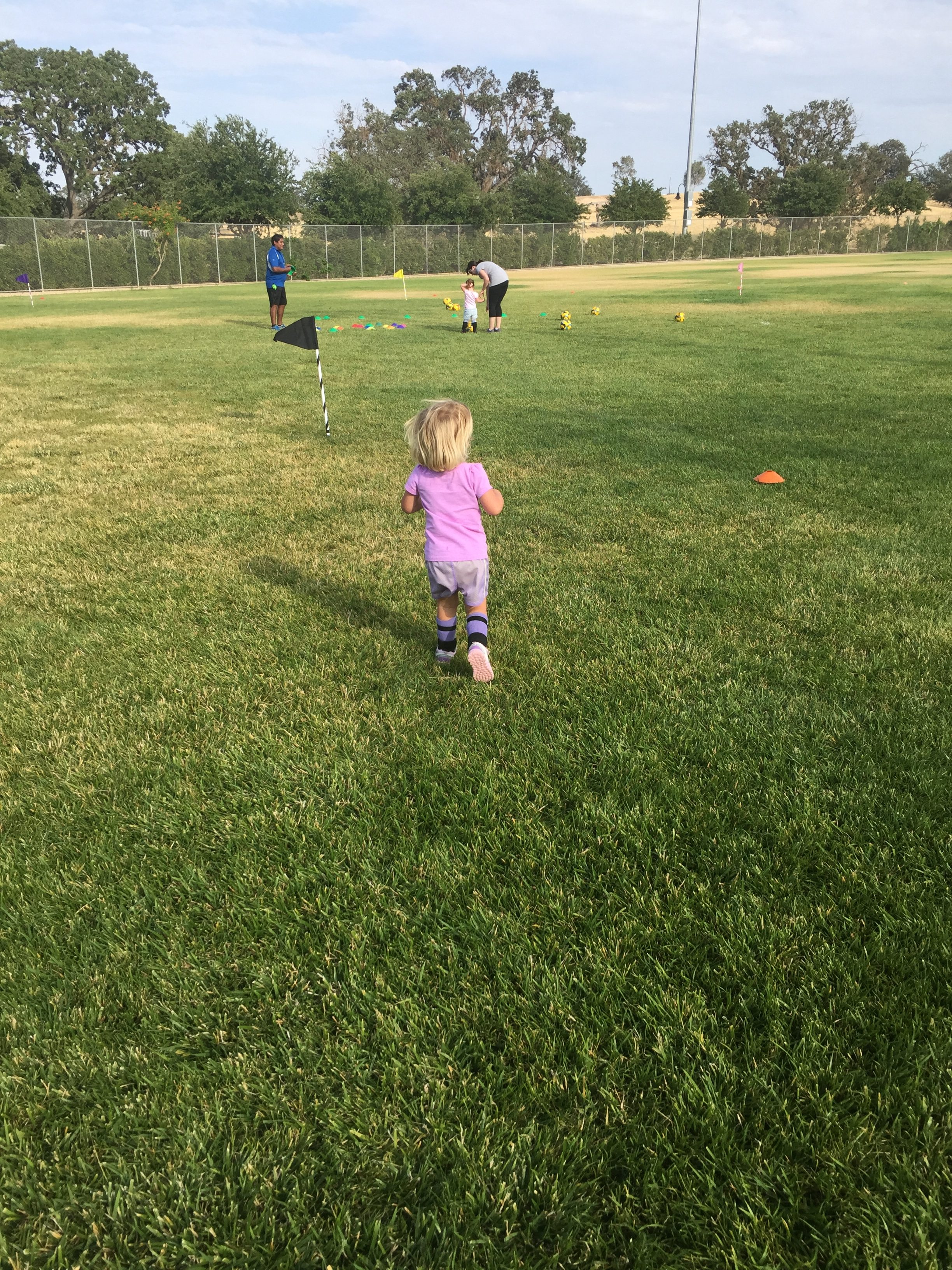 Running in the field at Kidz Love Soccer class in Paso Robles California