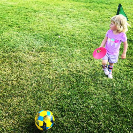 Here is a 2 year old at her first class of Kidz Love Soccer during a hot summer day in Paso Robles California. As posted in the blog Two In Tow & On The Go.