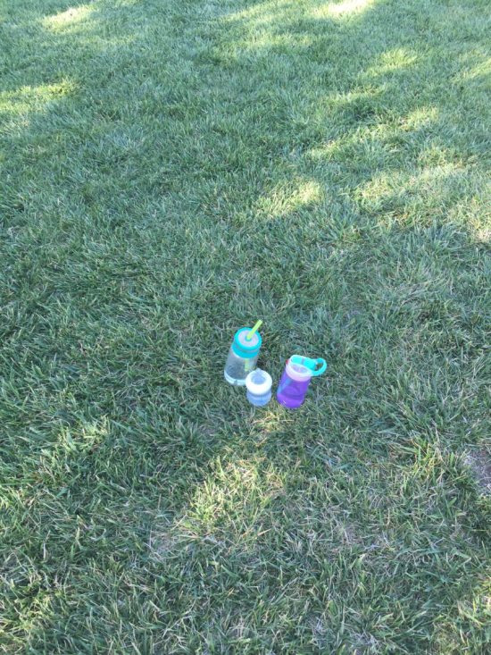 Water bottle break during a Kidz Love Soccer Class in Paso Robles California as blogged about on Two In Tow & On The Go.
