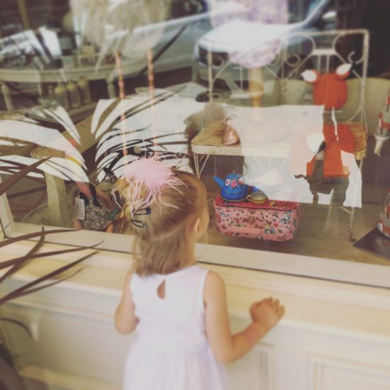 Little girl Window shopping at Bijou in Downtown Paso Robles California