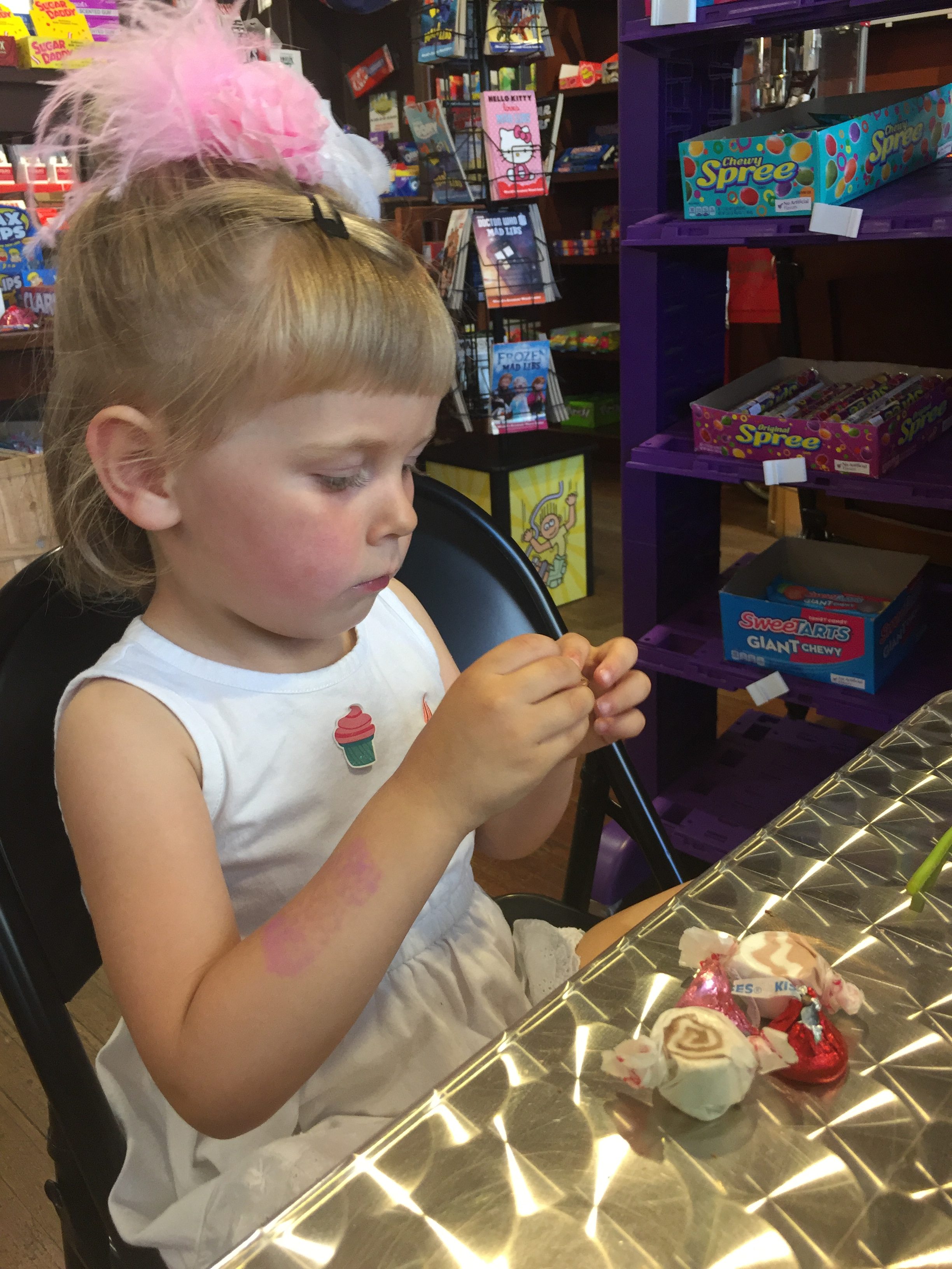Here is a photo of a 3 year old eating candy at SLO Sweets in Downtown Paso Robles. Things to do with Kids in Downtown Paso Robles.