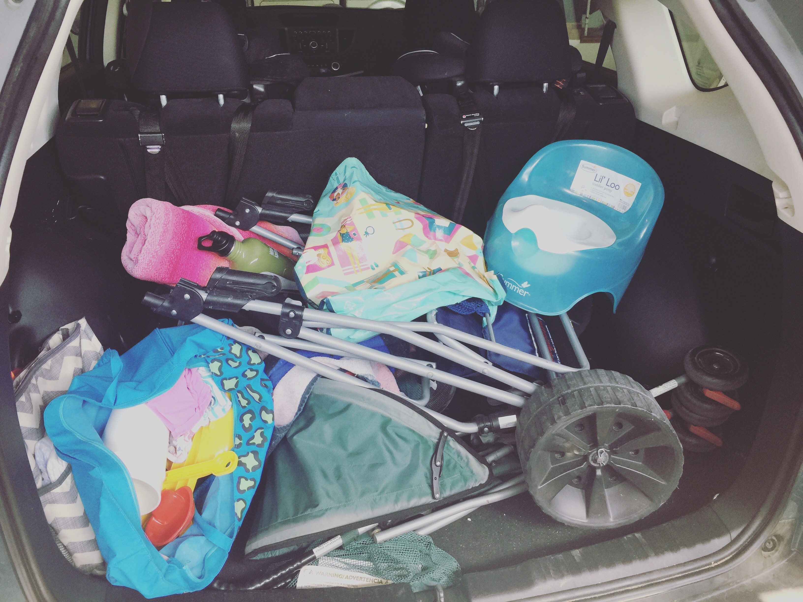 Packing the car for a beach trip with kids
