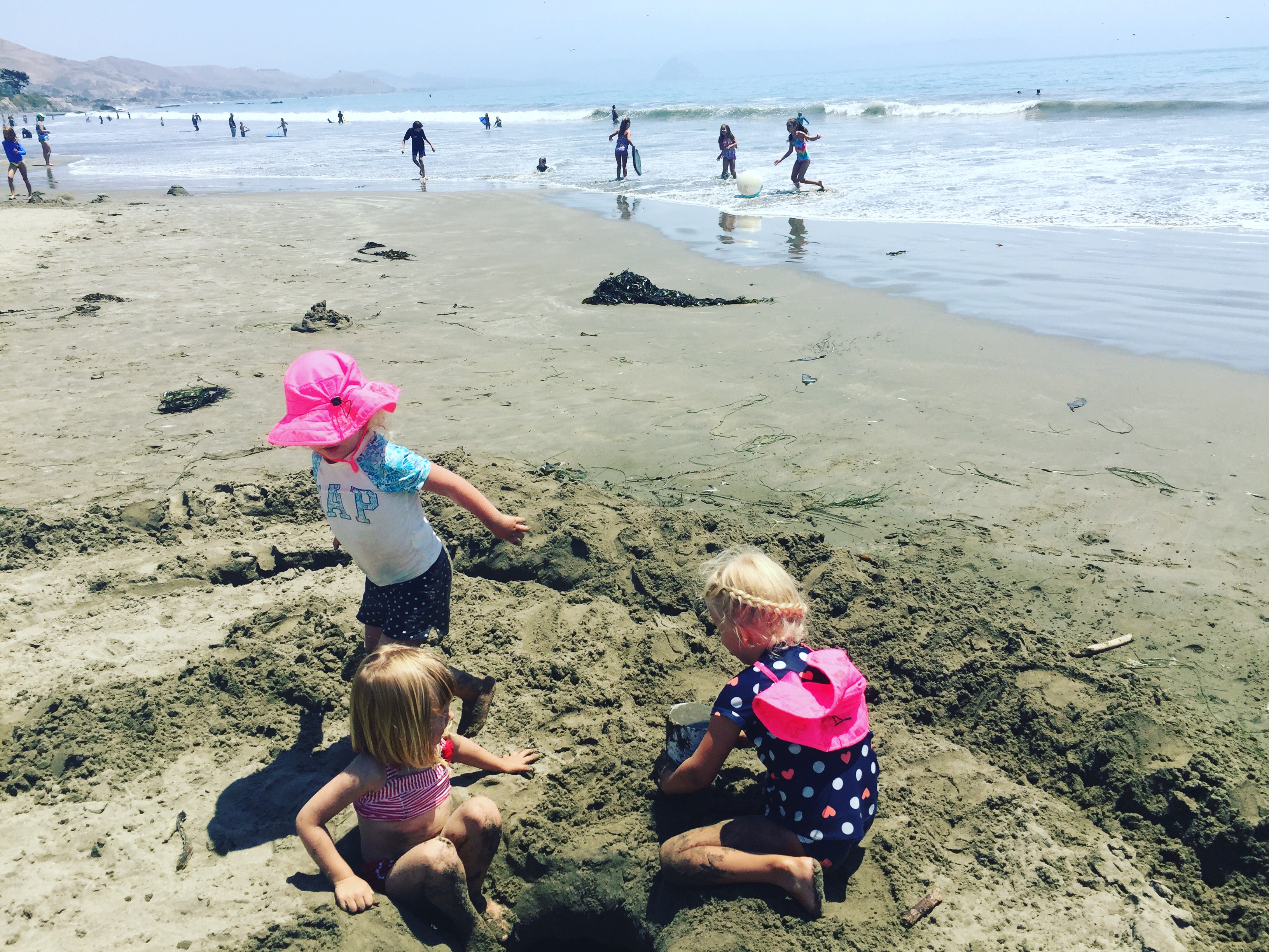 Kids in the sand at Cayucos State Beach Calfornia