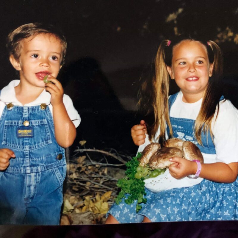 two kids in overalls