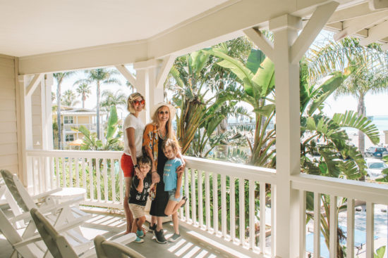 Family posing on balcony at Review of Avila Lighthouse Suites, Avila Beach