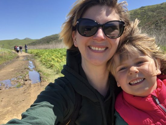 Mom and daughter on muddy hike selfie