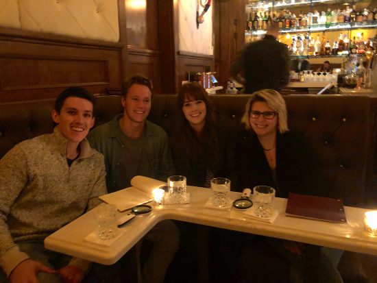 group in dimly lit bar