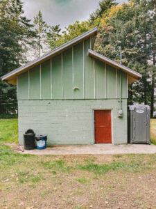 green building with red door