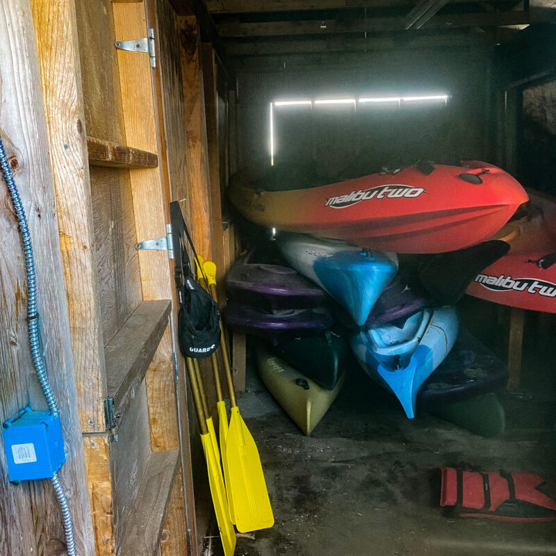 red kayaks in a shed
