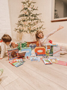 Kids together at the christmas tree