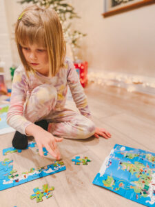 Child putting together a puzzle