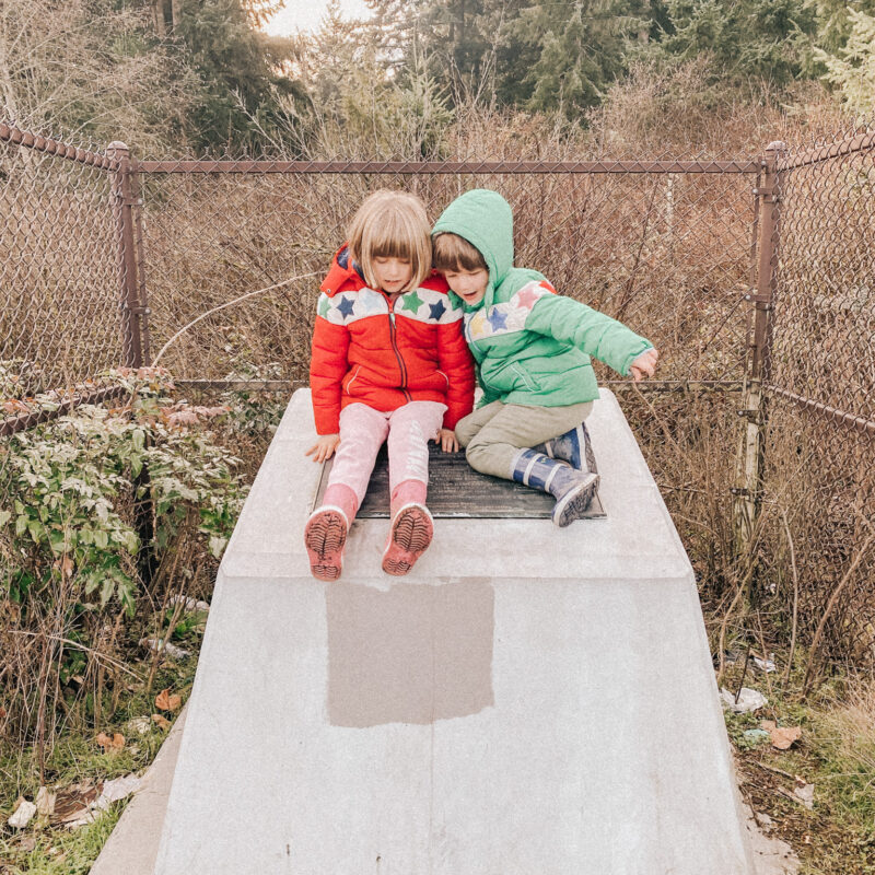 two kids on a concrete plaque