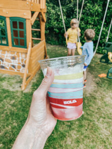 plastic solo cup with pink lemonade