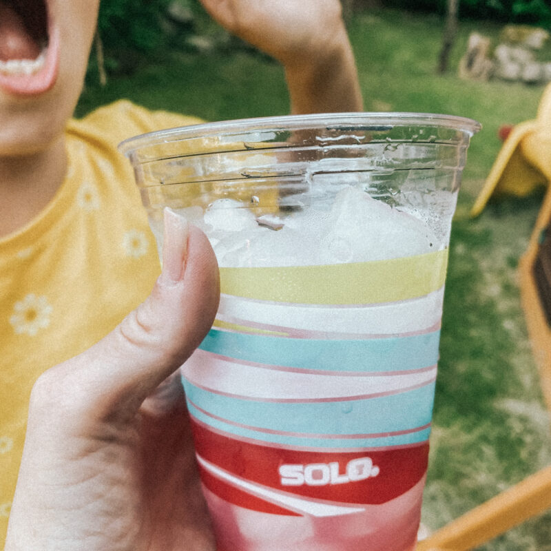 plastic solo cup with pink lemonade