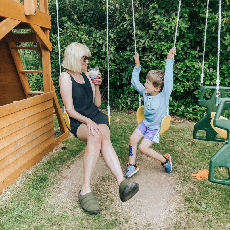 mom and son on swings