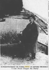newspaper photo of a man in a suit, standing in front of a beach