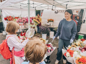 van of flowers and people