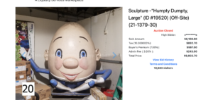 large humpty dumpty egg statue in blue clothes
