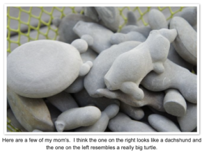 basket of smooth rocks shaped like animals