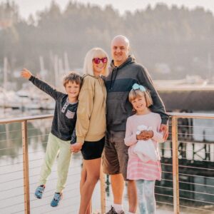 pic of mom, dad and two kids on dock