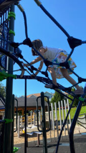 child on rope climber