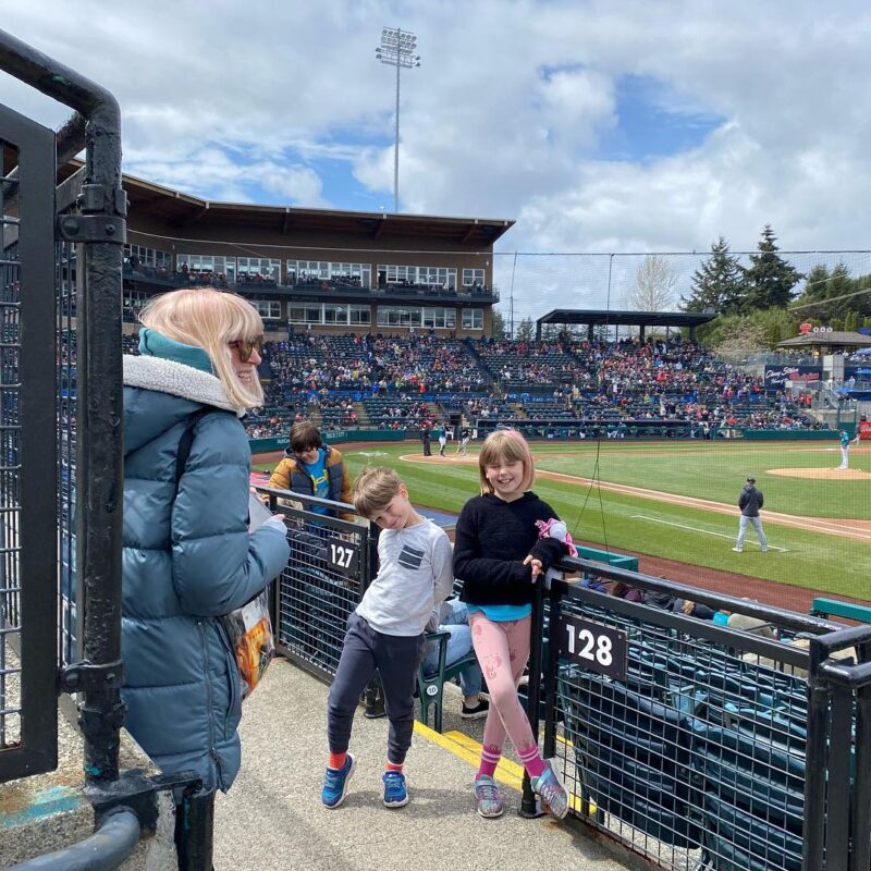 girl at baseball game with kids