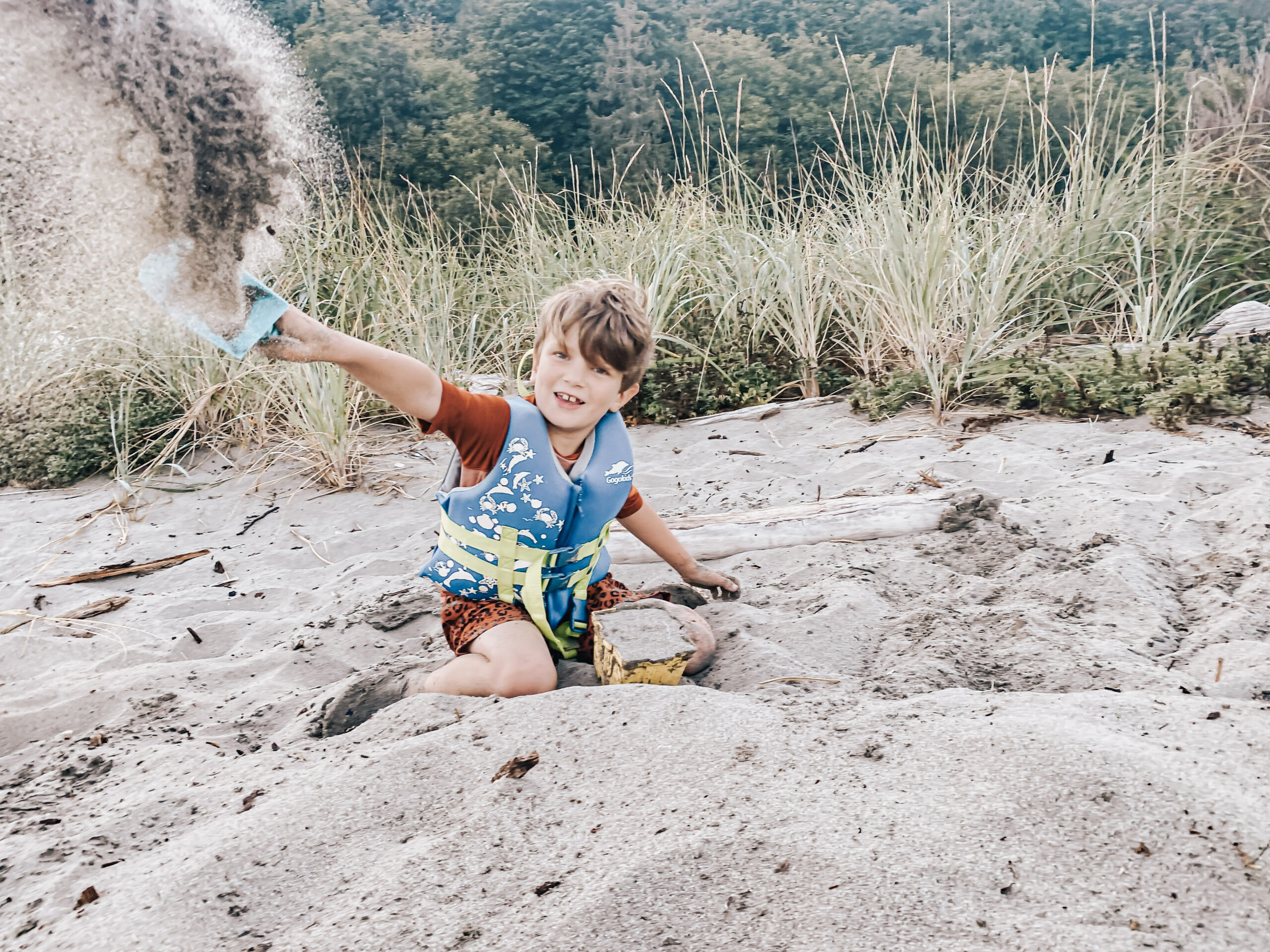 boy with sand on beach